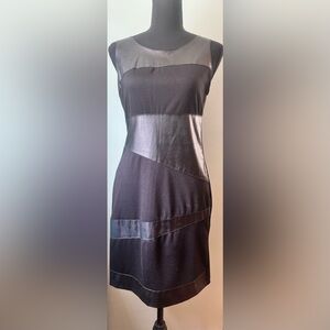 Black leather (partial) mini dress. Worn once. Zipper closure.